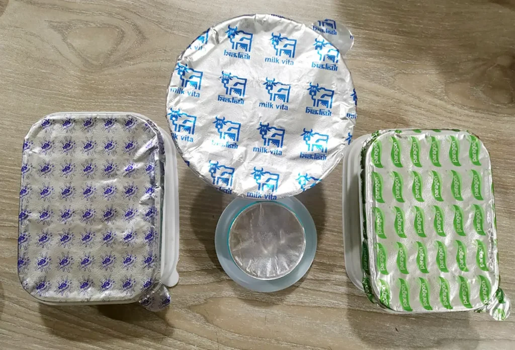 Printed aluminium lid foils for packaging containers by Vision Induction Wads Ltd.